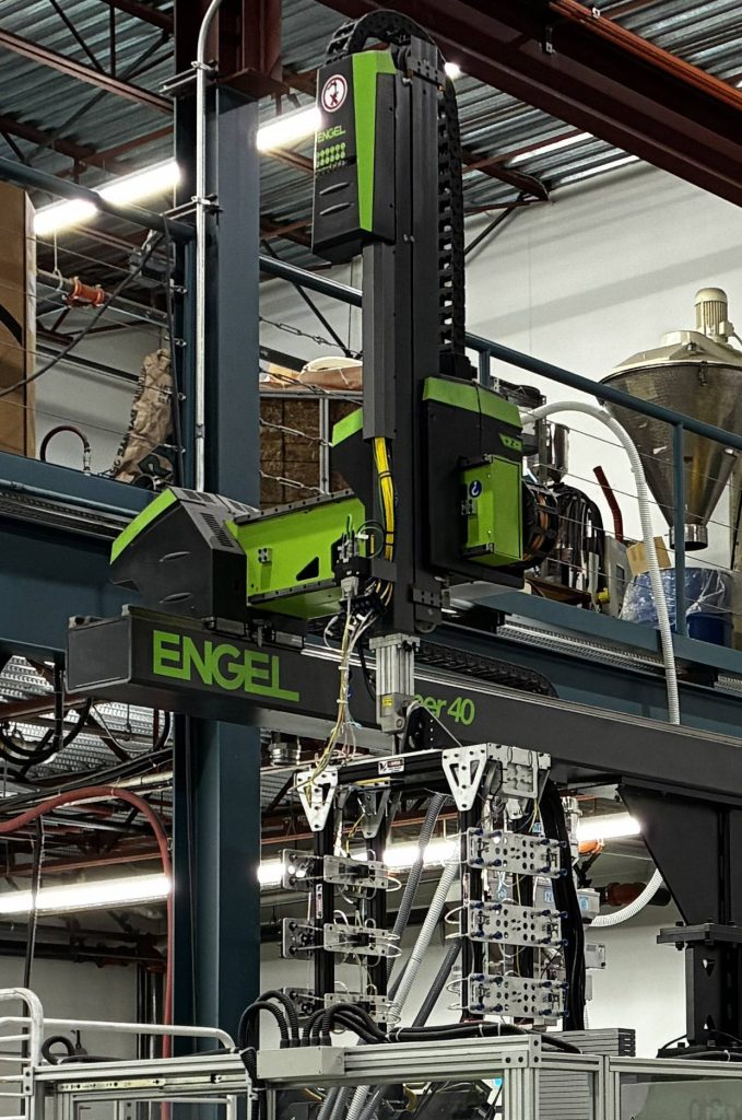 A robotic gantry arm for injection molded plastic parts