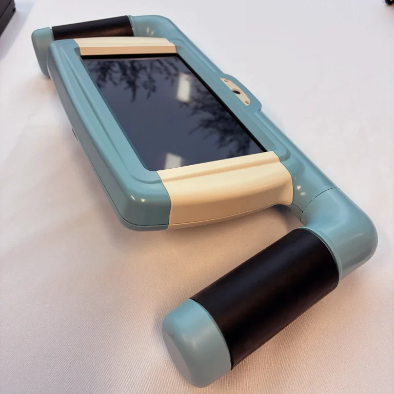 Medical device with overmolded elastomer handles.