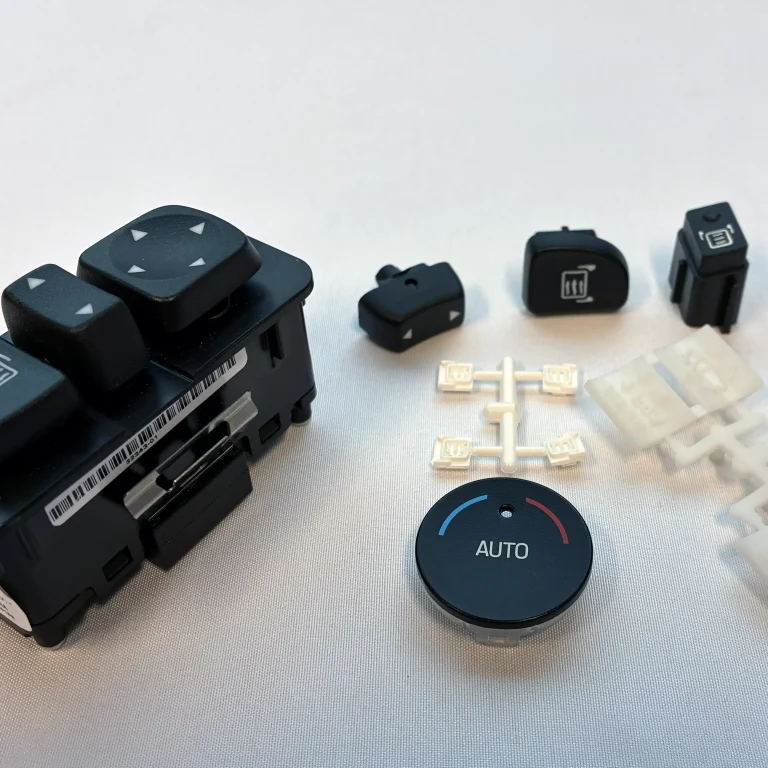 Automotive overmolded buttons.